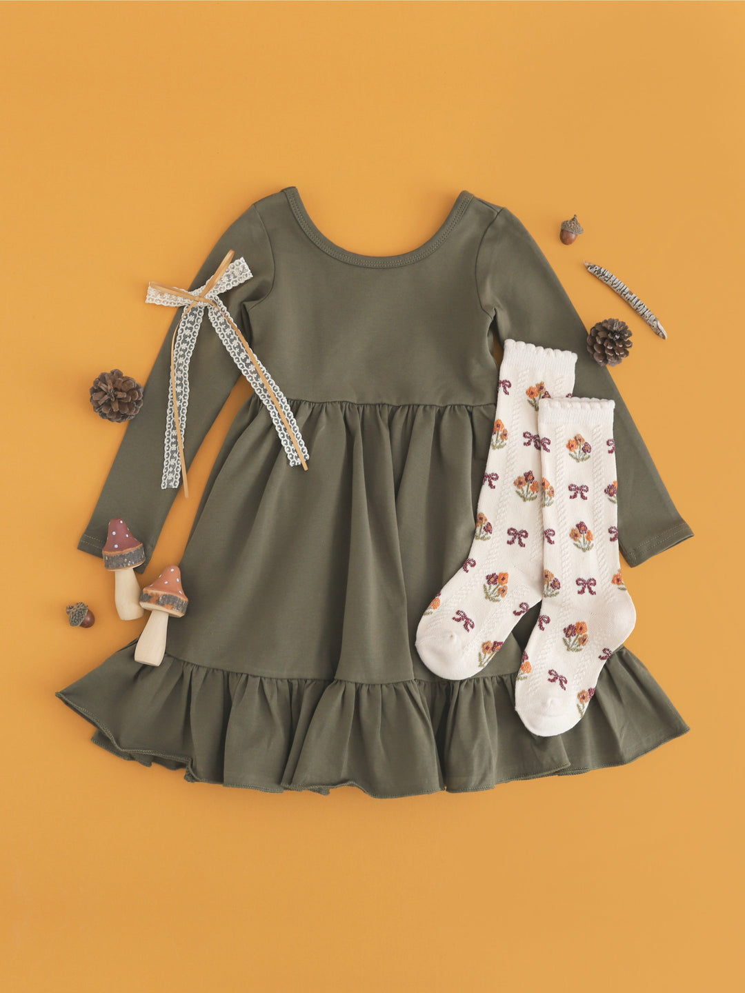 girls' long sleeve cotton blend olive twirl dress for fall paired with fall floral knee-high socks and matching cream and mustard lace ribbon bow