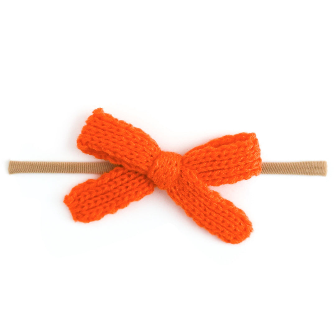 baby girls' orange yarn knit bow on stretchy nylon headband