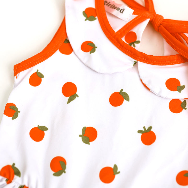 detail picture of girls' orange print dress