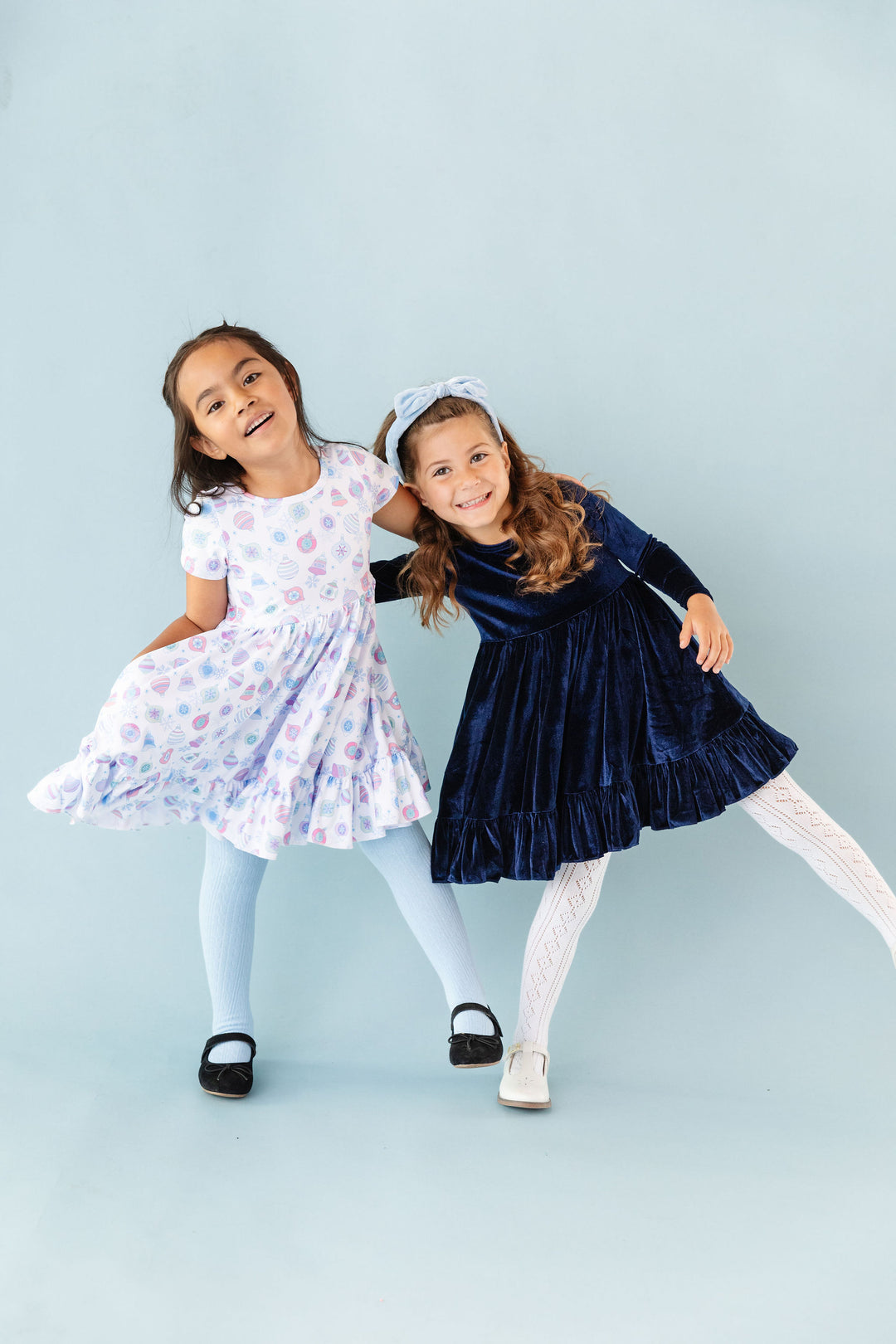 girls wearing blue holiday dresses 