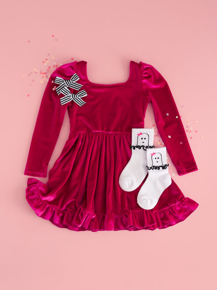 flat lay on light pink of girls&