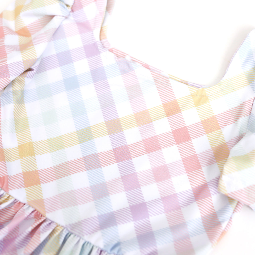 closeup of pastel gingham print on little girl's square neck Easter dress