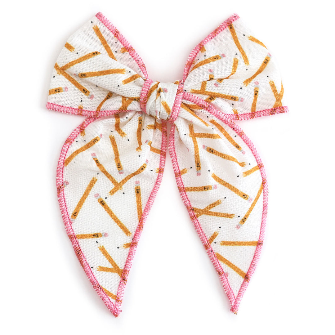 girls pencil print hand tied bow with pink trim for school