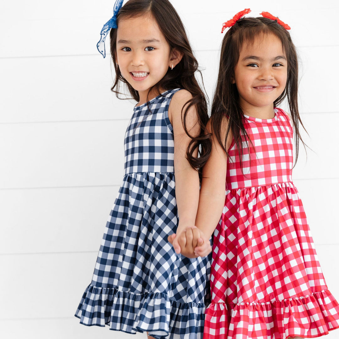 navy/white and red/white picnic plaid sumemr dress on two little girls 