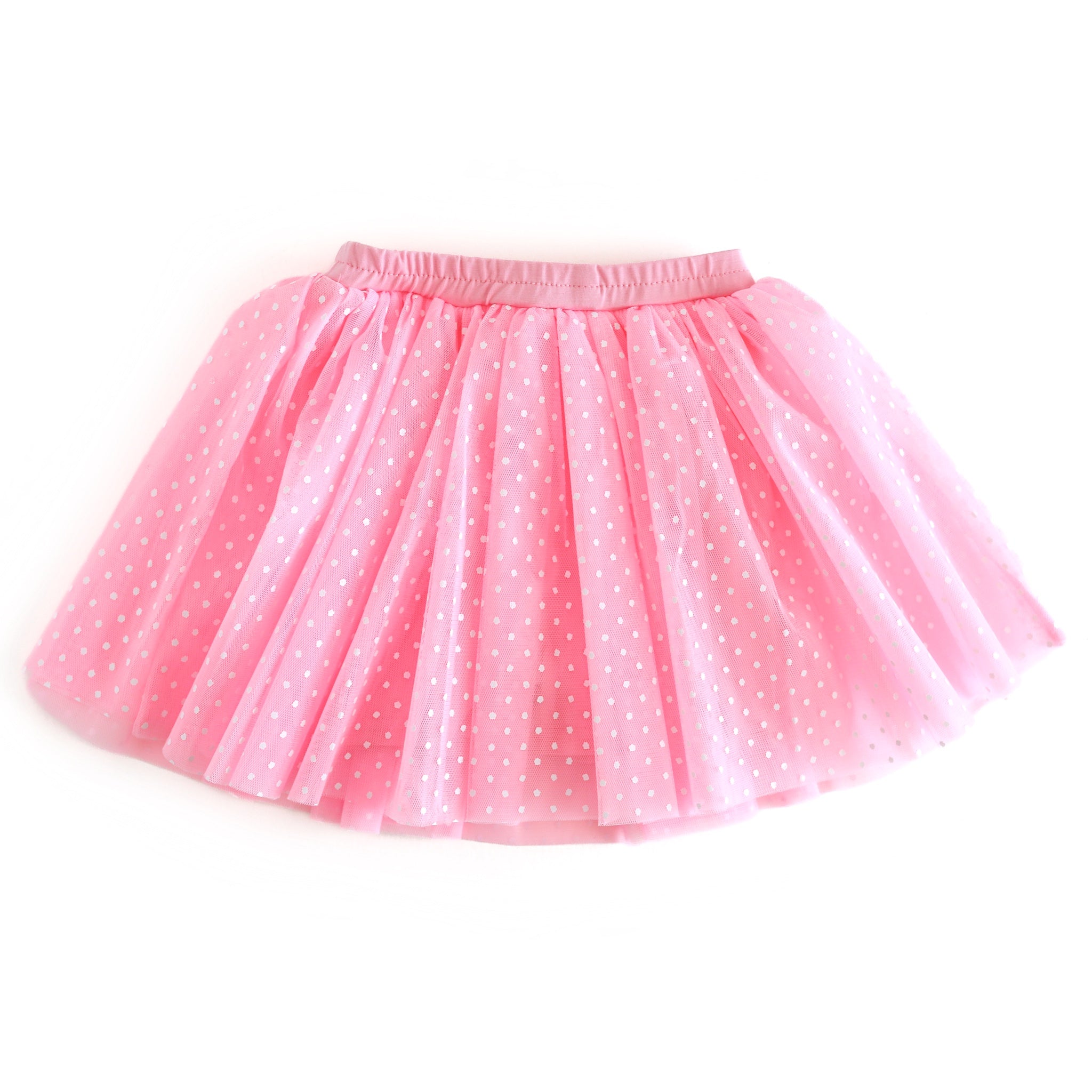 Pink tutu skirt with white polka dots on a white background