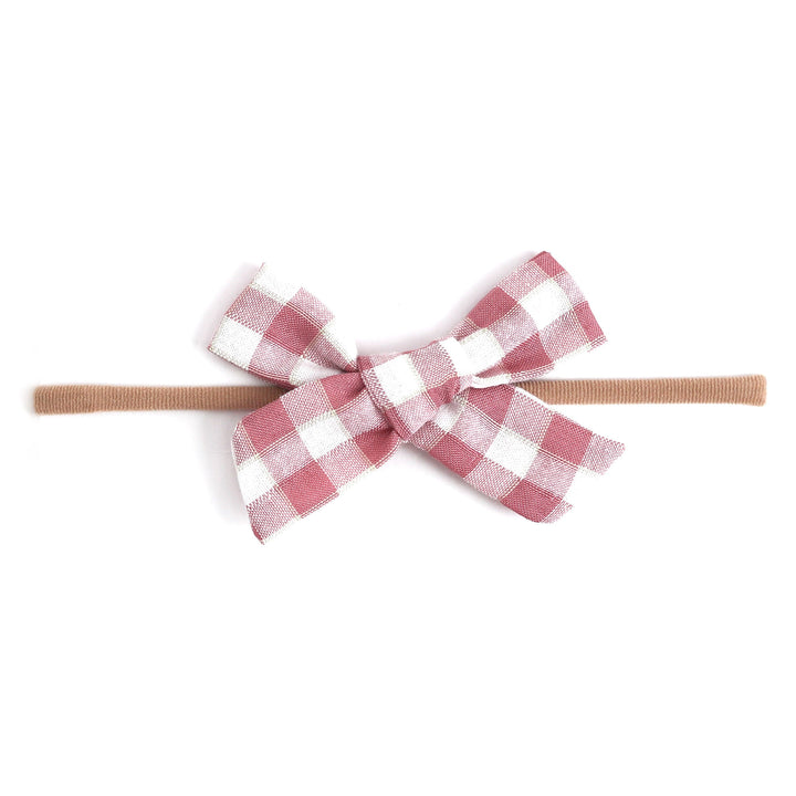 pink and white gingham baby bow on nylon headband