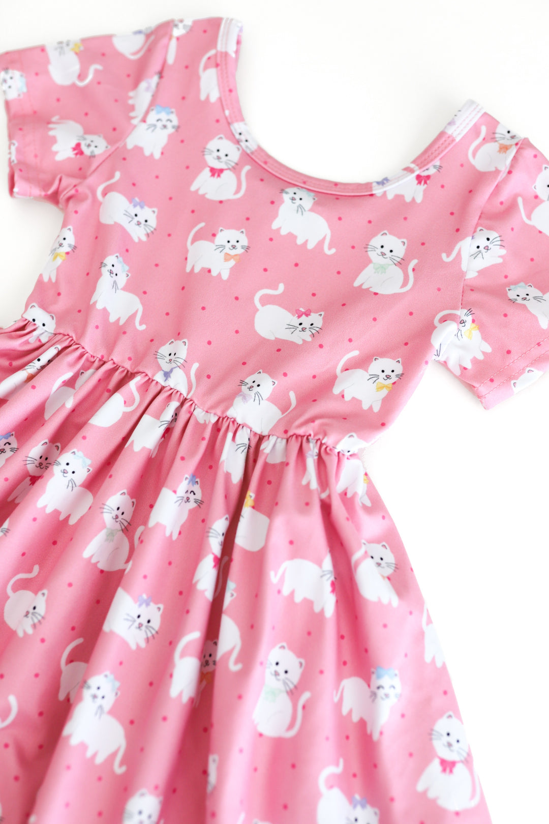 detail photo of girls pink short sleeve twirl dress with white kitten print