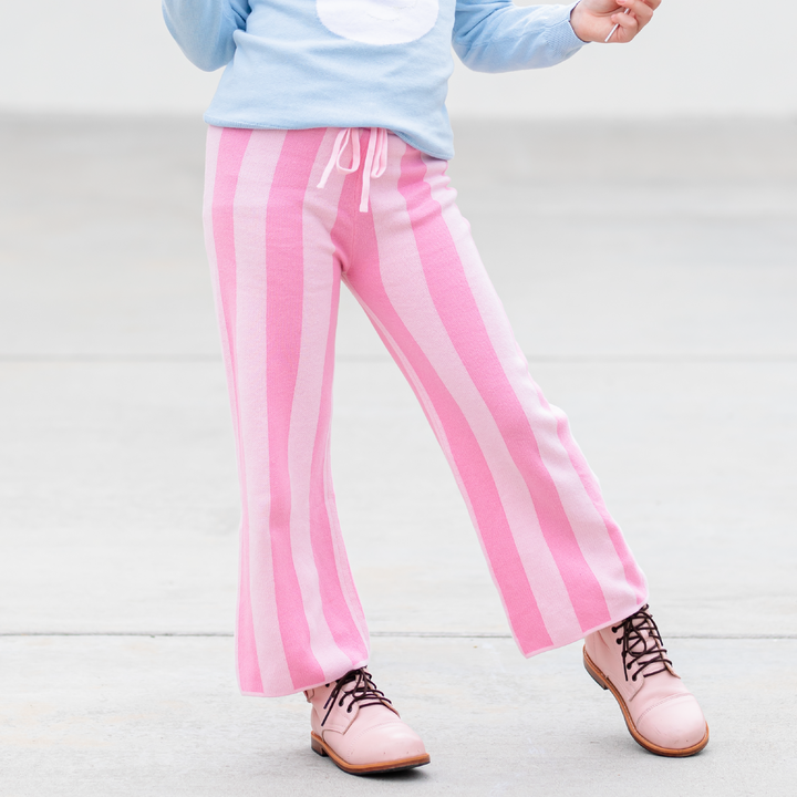 girl in pink striped sweater pants with drawstring tie