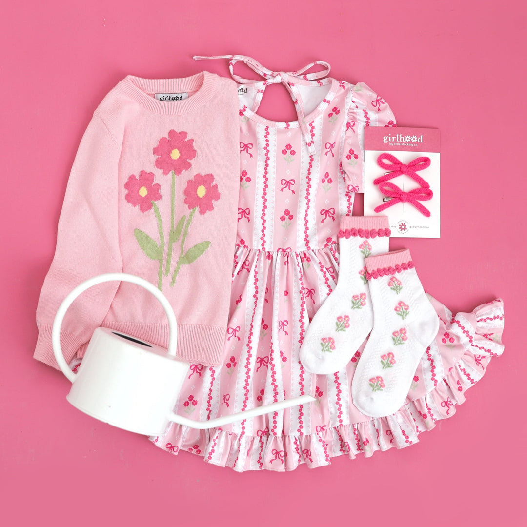 pink spring wallpaper print dress with pink flowers and bows and matching flower pullover and socks