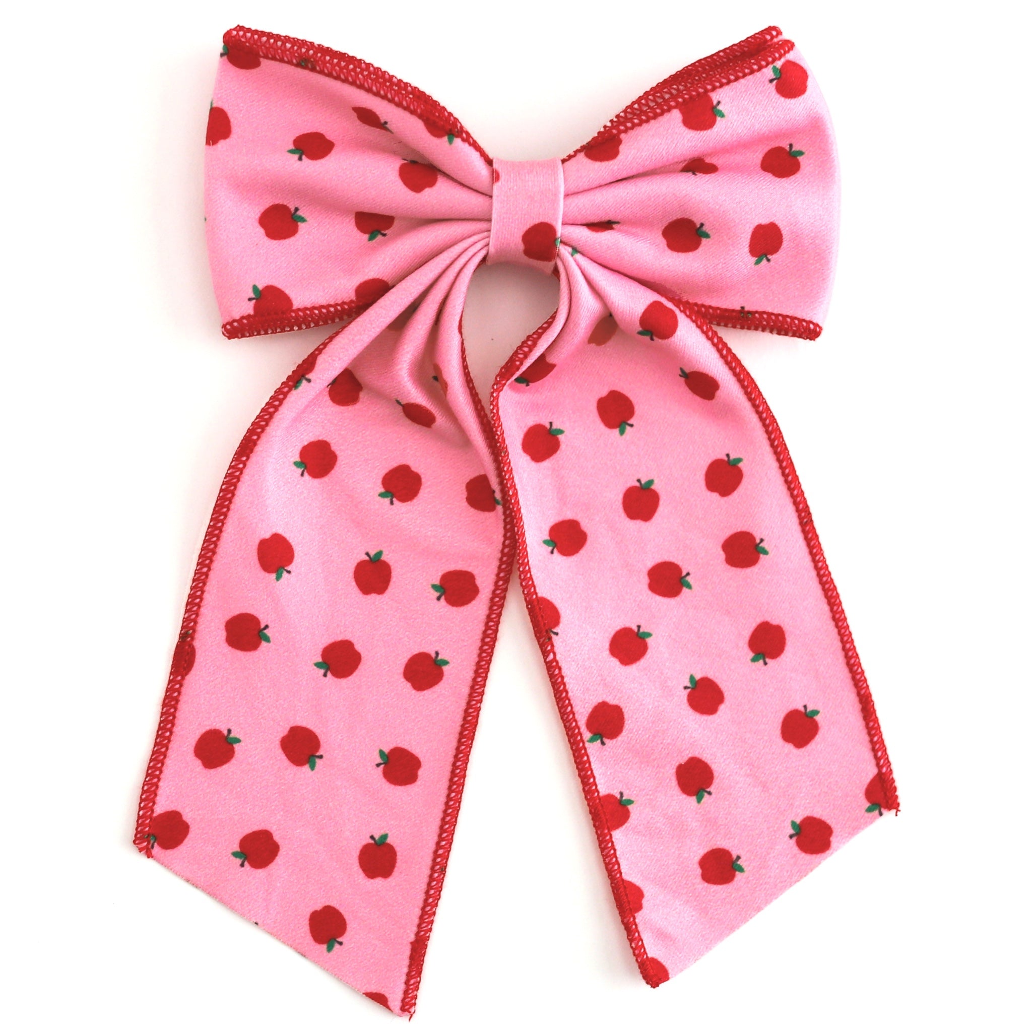 girls' pink oversized double hair bow with red apple print and red trim to match back to school apple print dress