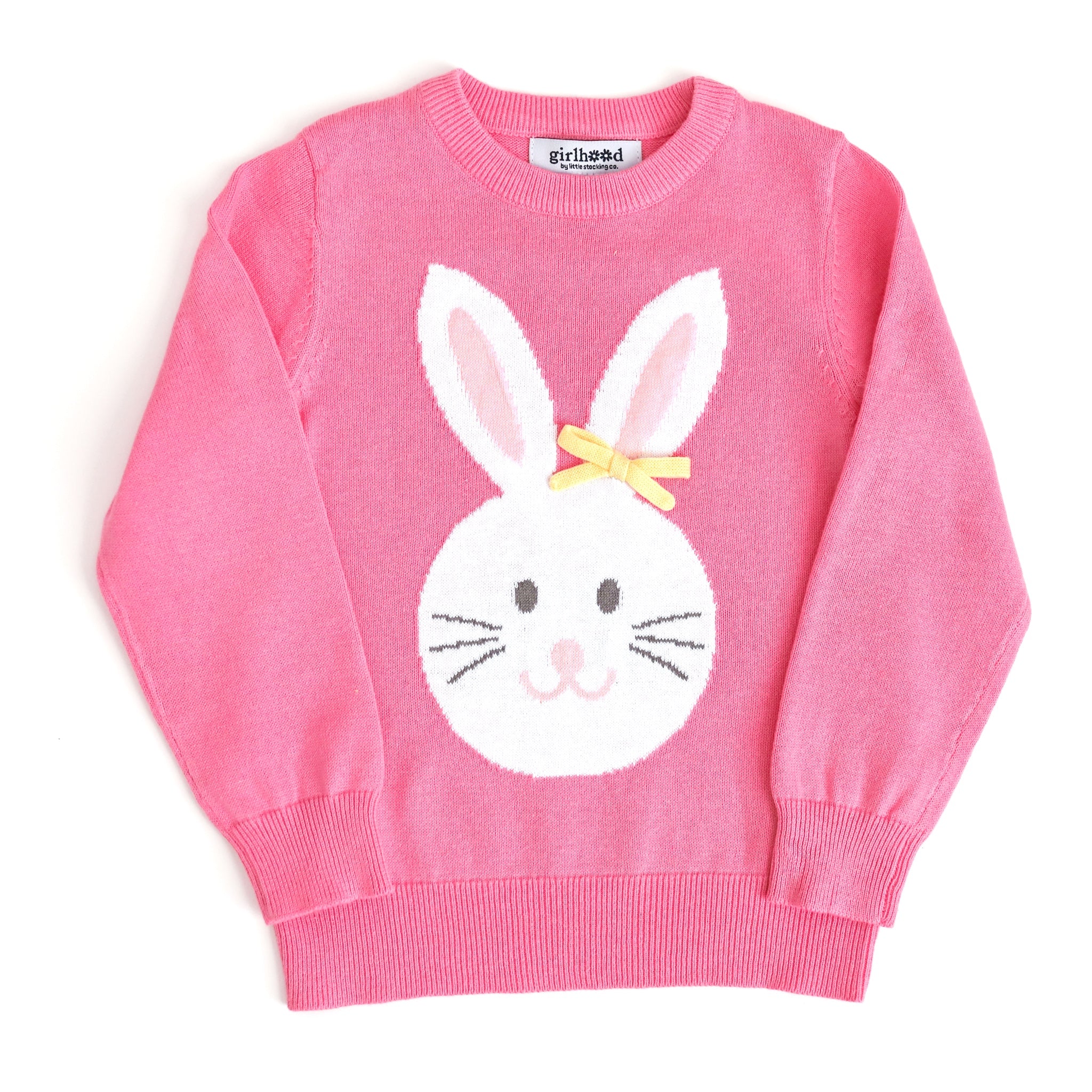 girl's pink cotton knit sweater with bunny wearing yellow knit bow on one ear