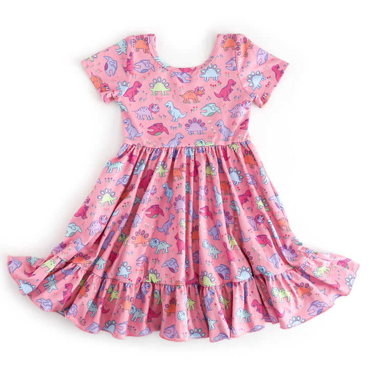 girls' pink short sleeve twirl dress with colorful pastel dinosaur print and ruffled hem