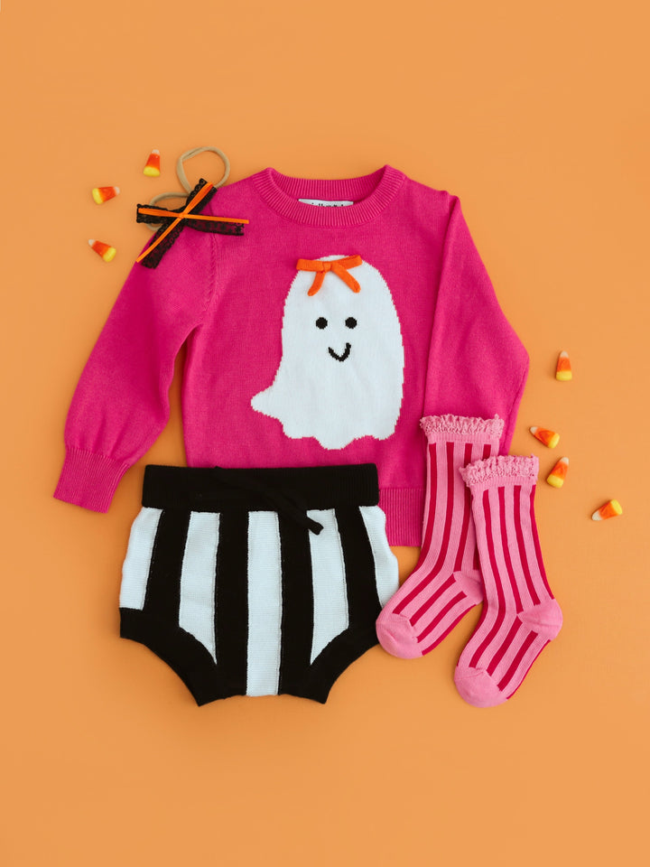 Baby girls' Halloween sweater set with bright pink sweater with white ghost design, black and white striped knit bloomers, pink striped knee highs and matching lace baby bow