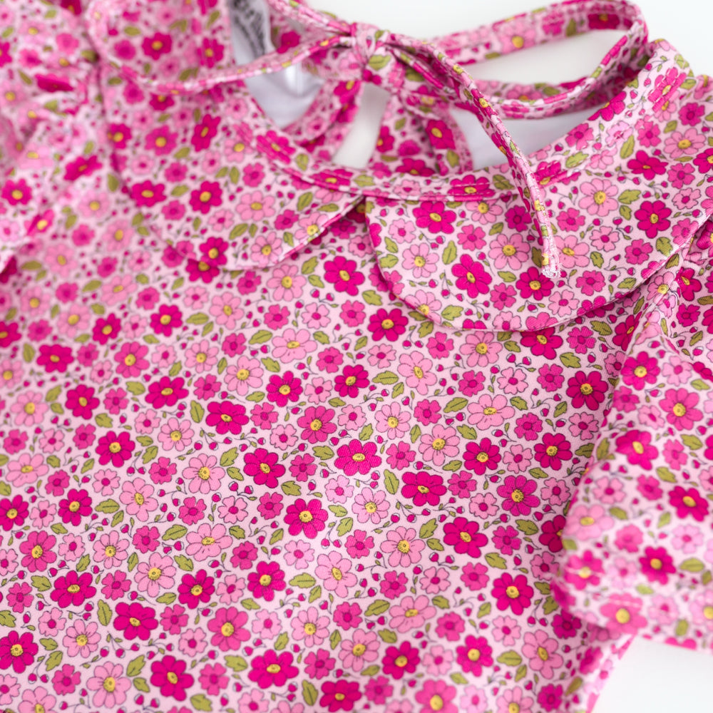 detail photo of petite floral print in shades of pink on dress bodice with peter pan collar