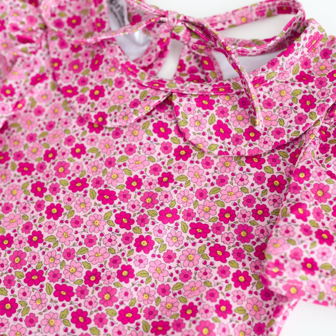 detail photo of petite floral print in shades of pink on dress bodice with peter pan collar