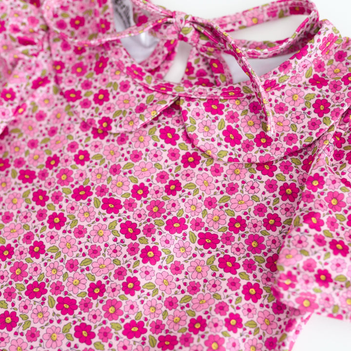 detail photo of petite floral print in shades of pink on dress bodice with peter pan collar