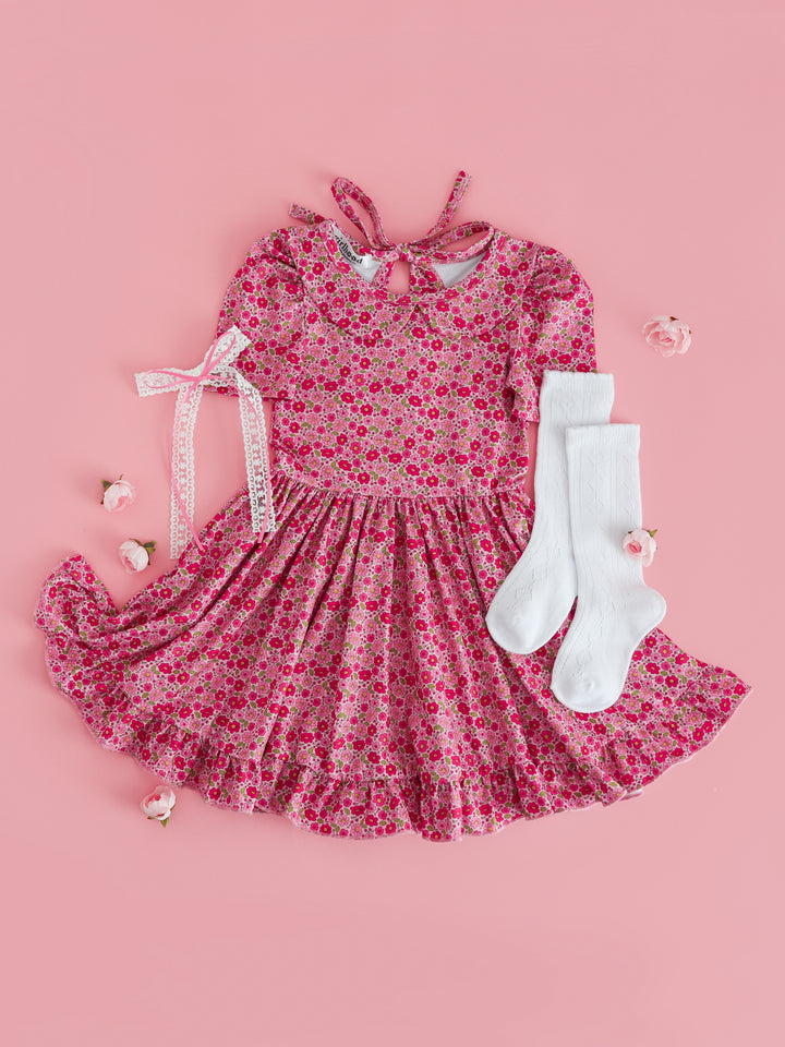 girls' pink micro floral print twirl dress with short, puffed sleeves and peter pan collar paired with white accessories