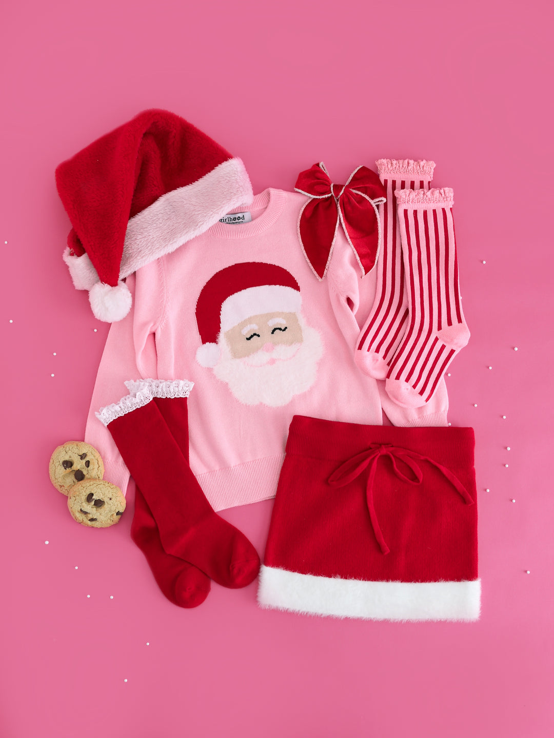 girls pink Christmas sweater with Santa design, red with white fluffy trin sweater skirt, matching Santa baby socks and bow