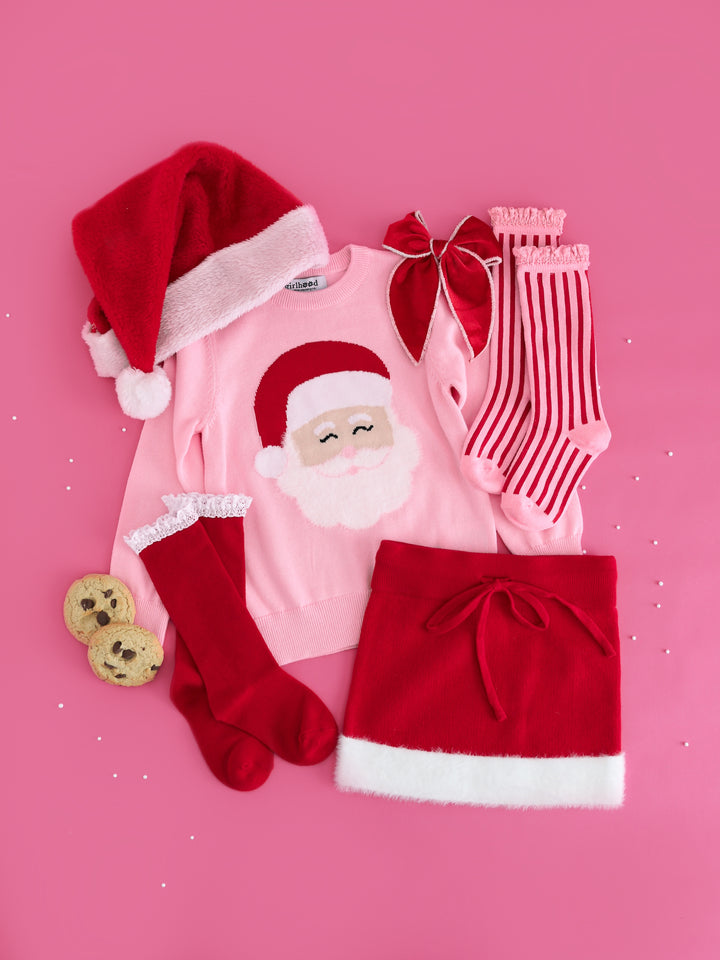 girls pink Christmas sweater with Santa design, red with white fluffy trin sweater skirt, matching Santa baby socks and bow