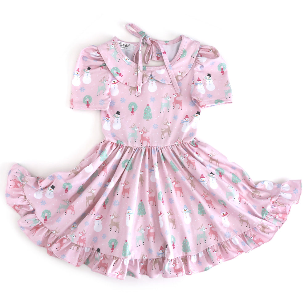 girls' light pink short sleeve collared twirl dress with winter wonderland themed Christmas print in pastels