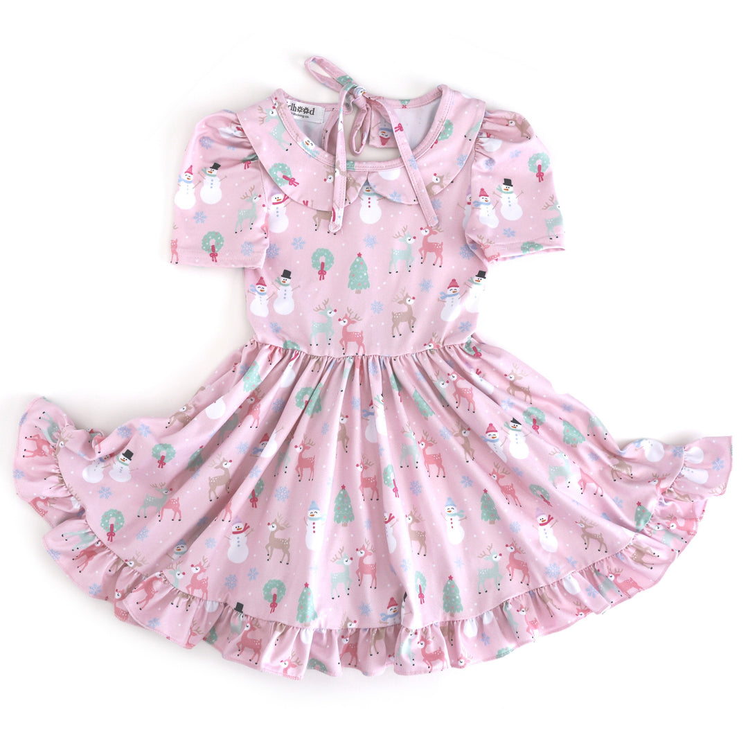 girls' light pink short sleeve collared twirl dress with winter wonderland themed Christmas print in pastels