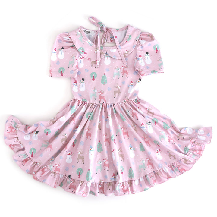 girls' light pink short sleeve collared twirl dress with winter wonderland themed Christmas print in pastels