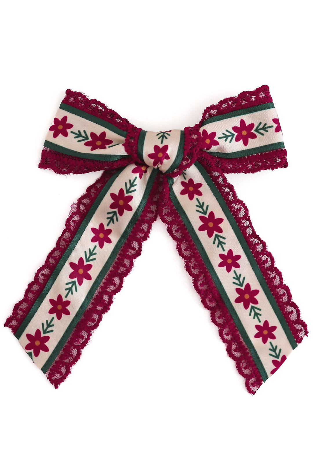printed poinsettia ribbon hair bow on crimson lace shown on white background
