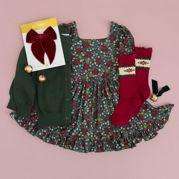 girls Christmas dress with green, crimson and gold poinsettia print and matching sweater, knee highs and bow