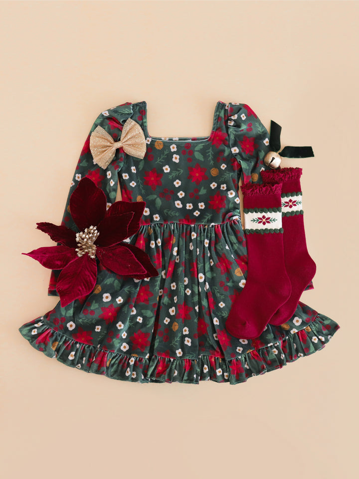 girls' poinsettia print velvet Christmas twirl dress with matching crimson poinsettia knee high socks and gold glitter tutu bow 