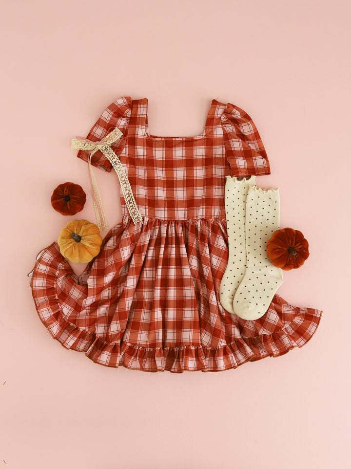 girls pumpkin spice plaid square neck twirl dress styled with cream Dottie knee socks and matching cream and mustard lace hair bow for harvest season