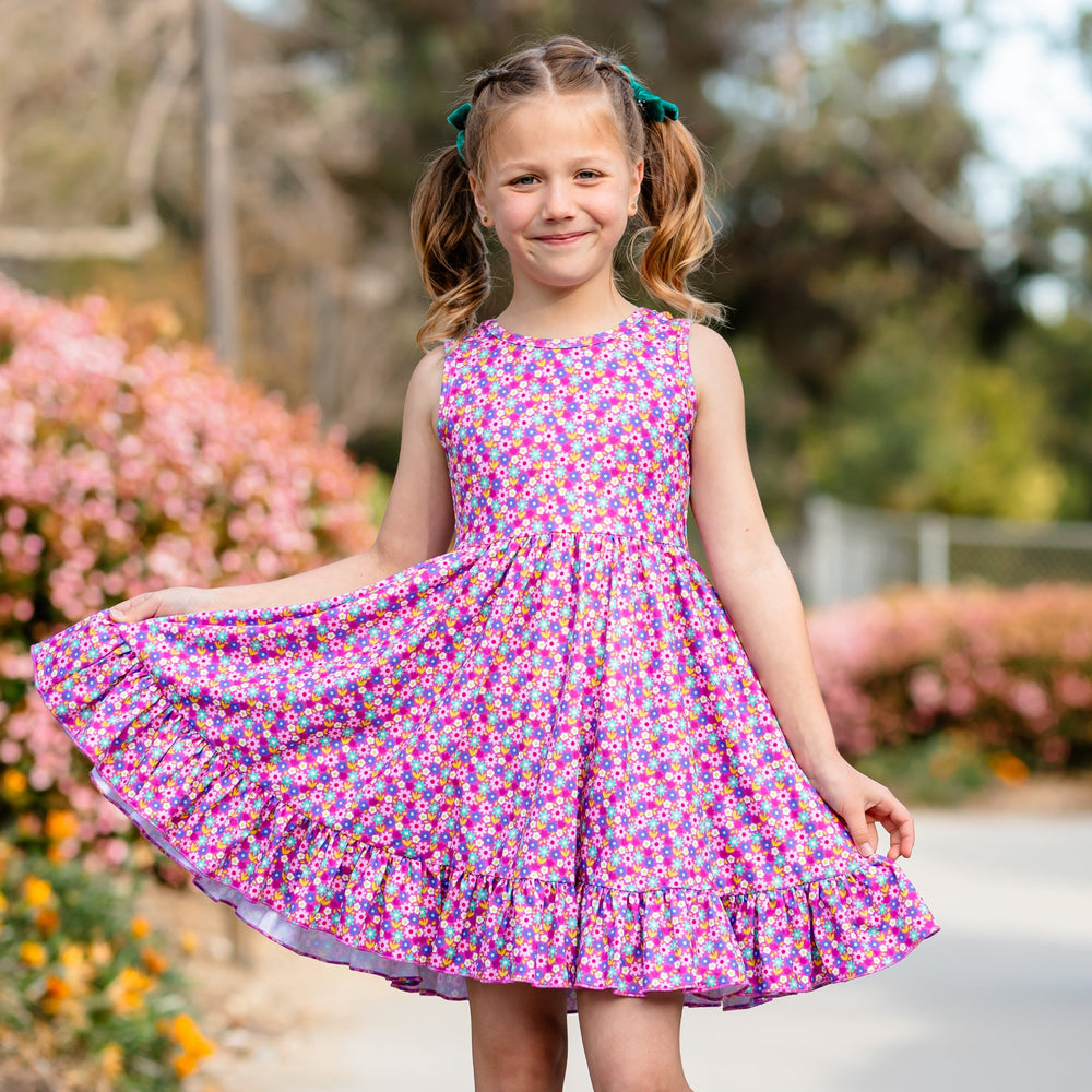little girl wearing purple floral tank style summer dress
