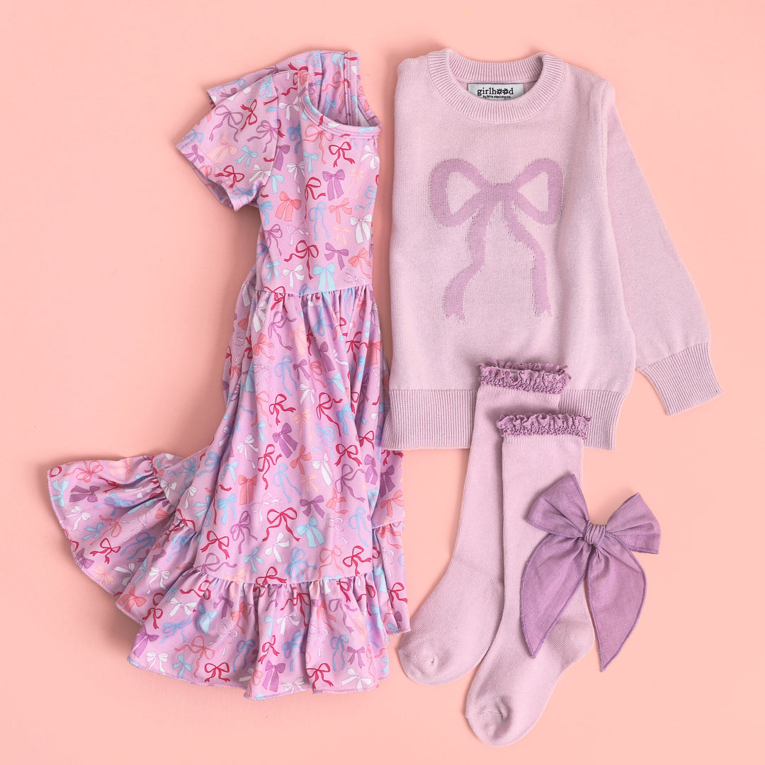 girls lavender twirl dress with bow print paired with matching purple bow sweater, lace top knee highs and linen hair bow