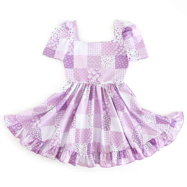 girls square neck short sleeve twirl dress with a floral patchwork print in shades of lavender for spring