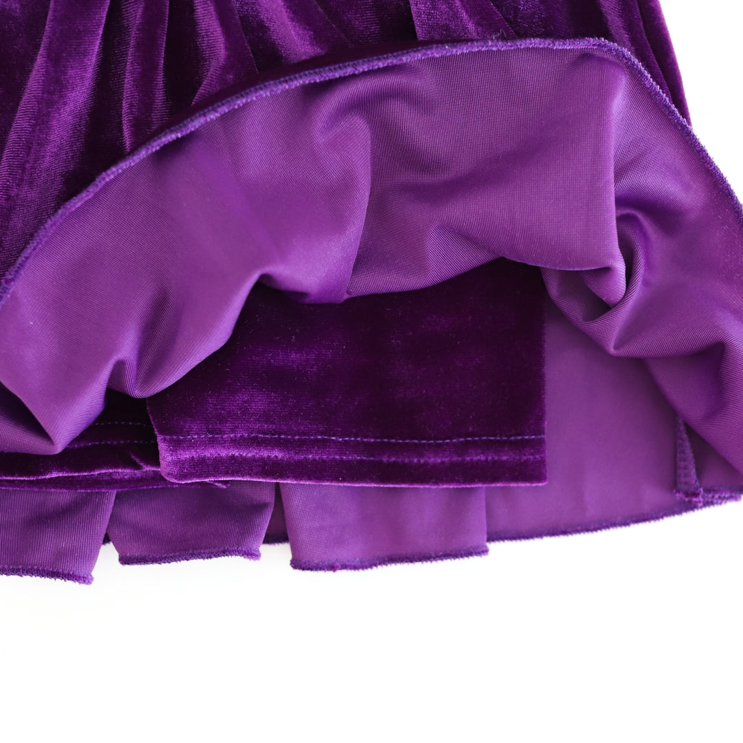 closeup of deep purple velvet shorts attached to Girlhood Skort