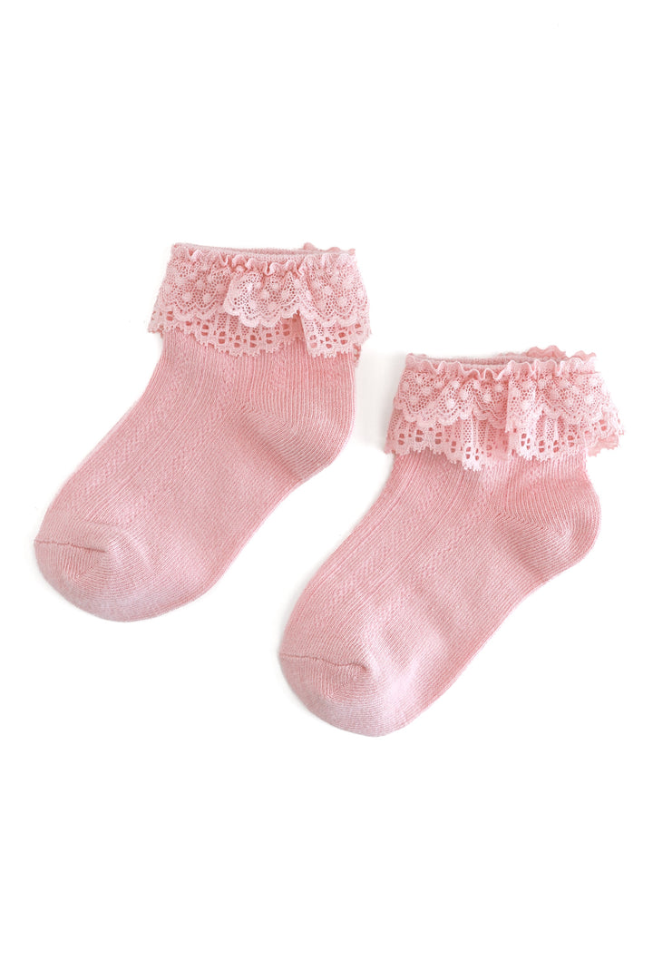 A pair of light pink ankle socks with delicate lace ruffles at the top, displayed on a clean white background.