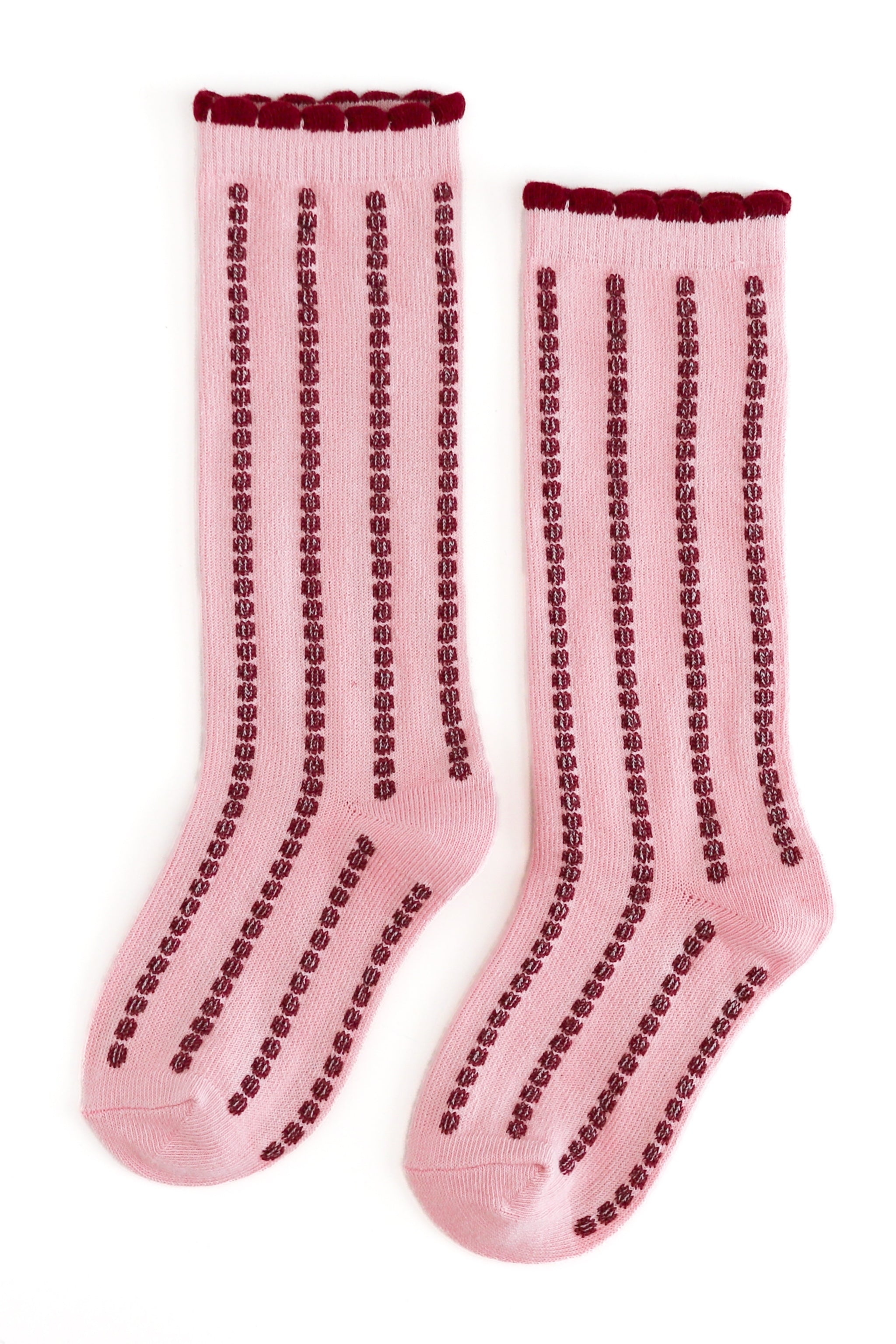 Girls' pink knee socks with crimson vertical bubble stripes and scalloped trim for Christmas