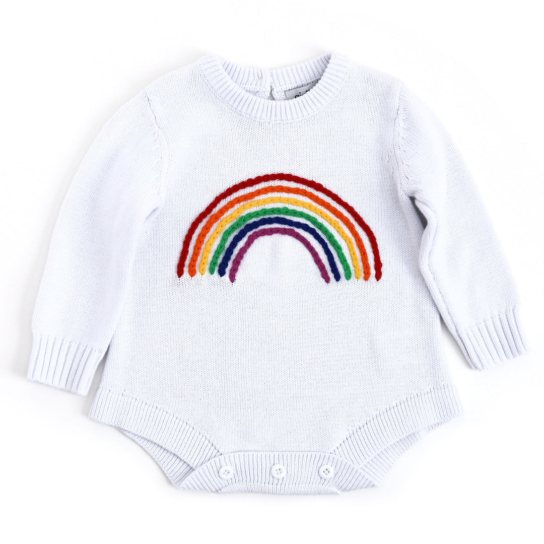 baby and toddler sweater romper in white with hand embroidered rainbow design on front