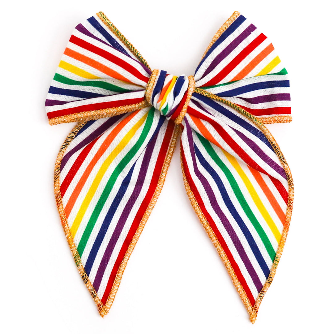 rainbow stripe hair bow with sparkly gold trim