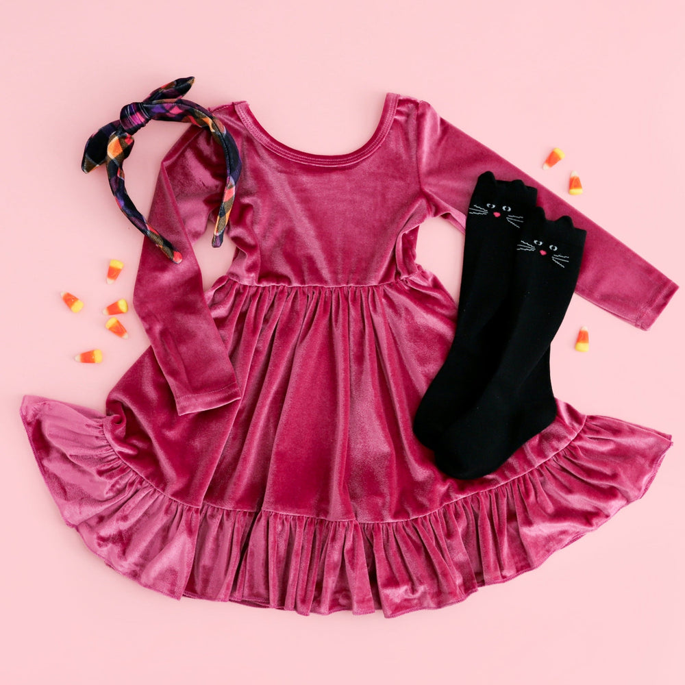 girls' fall pink velvet long sleeve twirl dress with ruffle hem paired with black cat knee highs and Halloween plaid headband