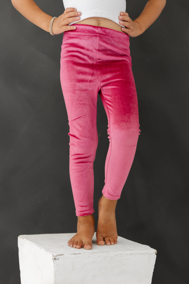 little girl in raspberry pink velvet leggings for fall and Halloween