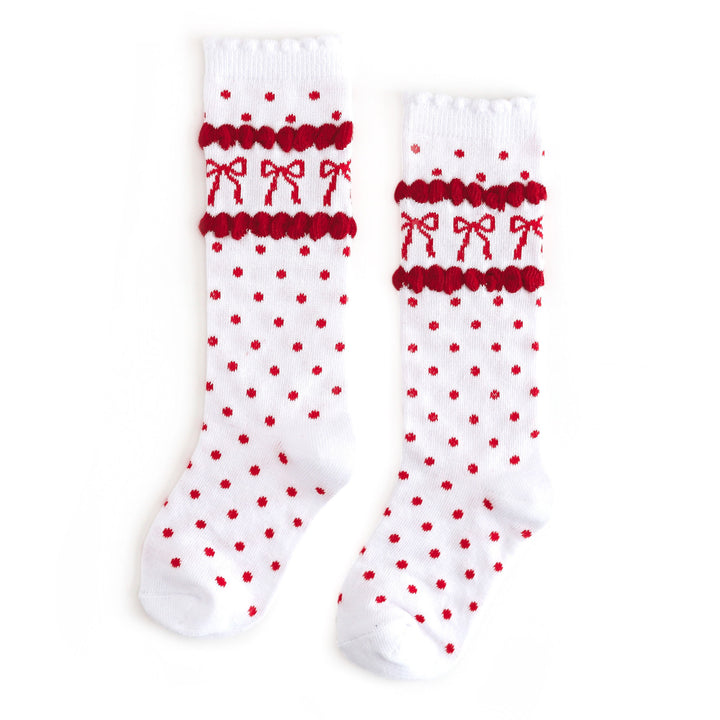 girl's scallop trimmed knee highs in white with red dots and red bow print