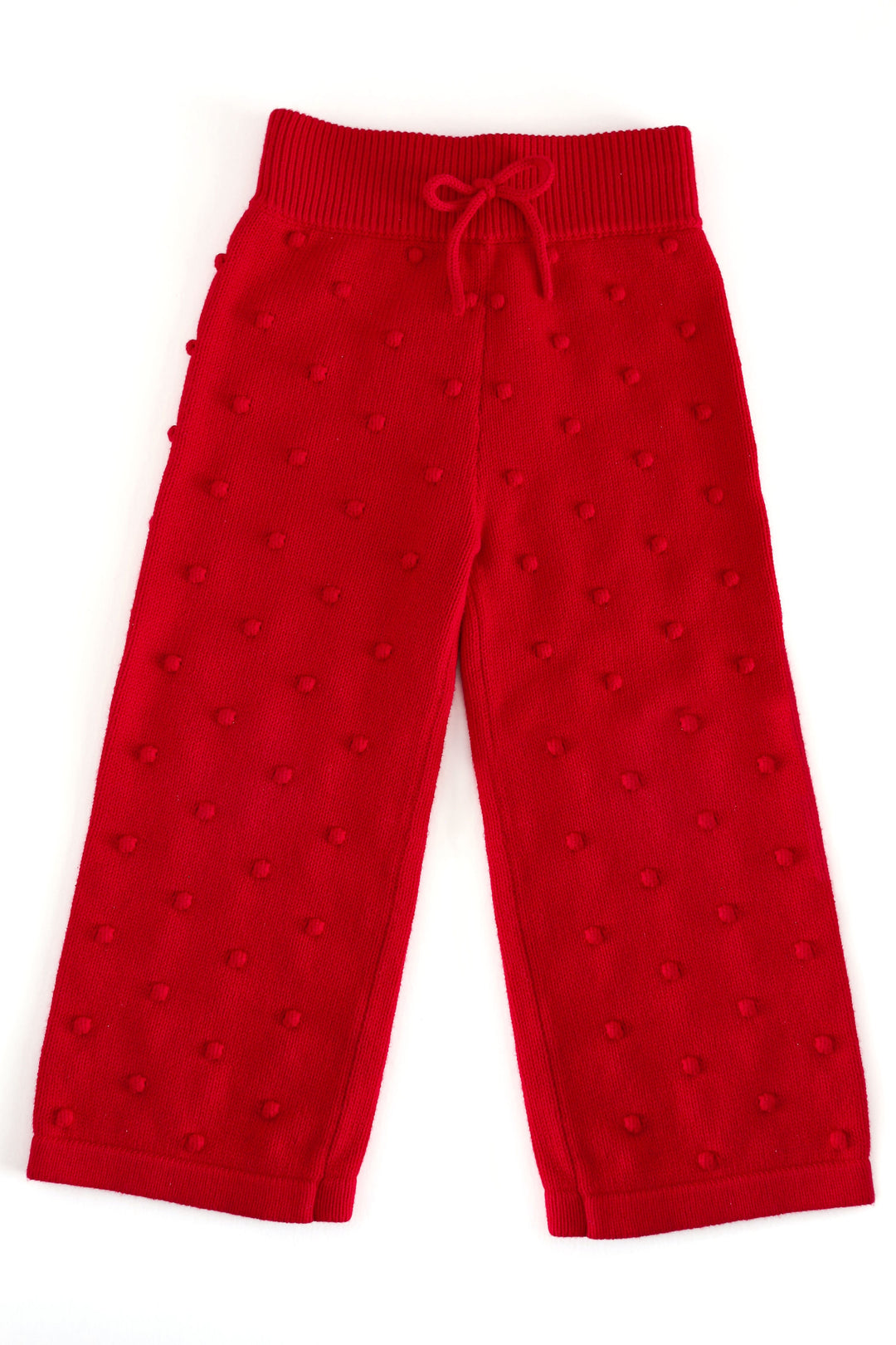 girls' red knit sweater pants with bubble/pom-pom design knit in fabric with a ribbed waistband and faux bow 