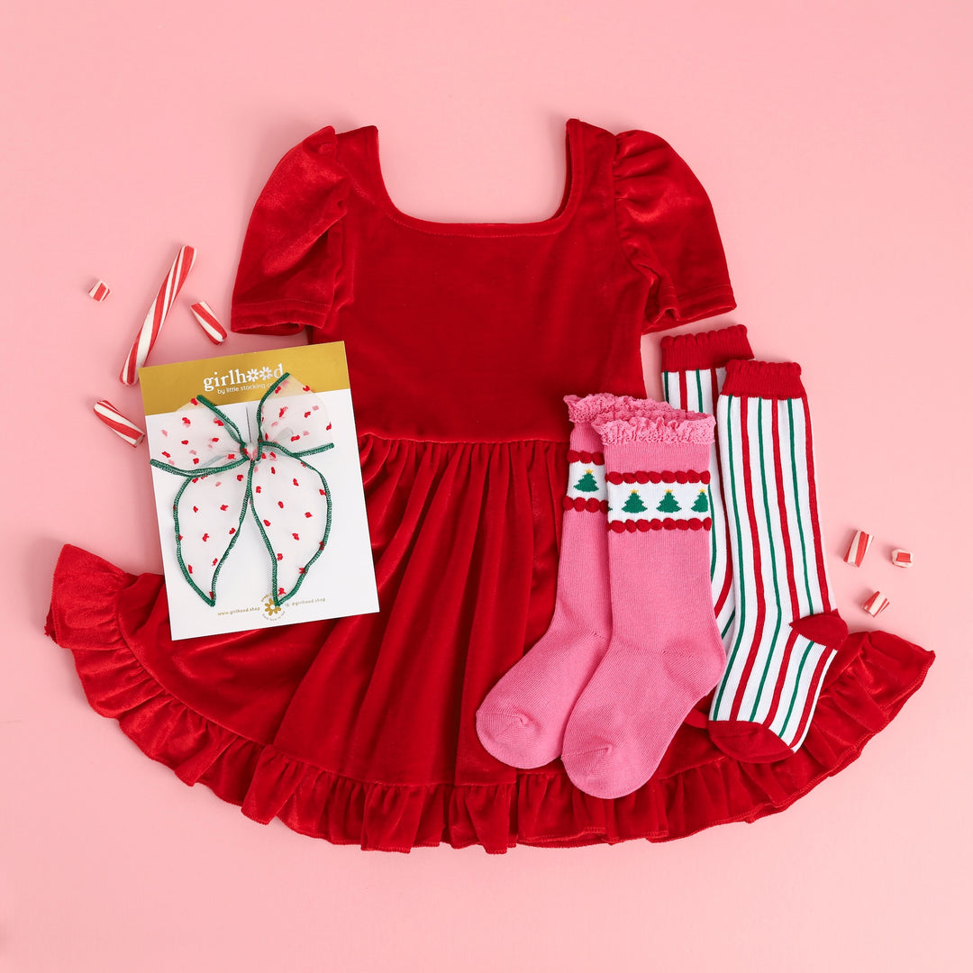 girls red velvet holiday twirl dress with christmas tree socks and candy cane stripe socks and red and green bow