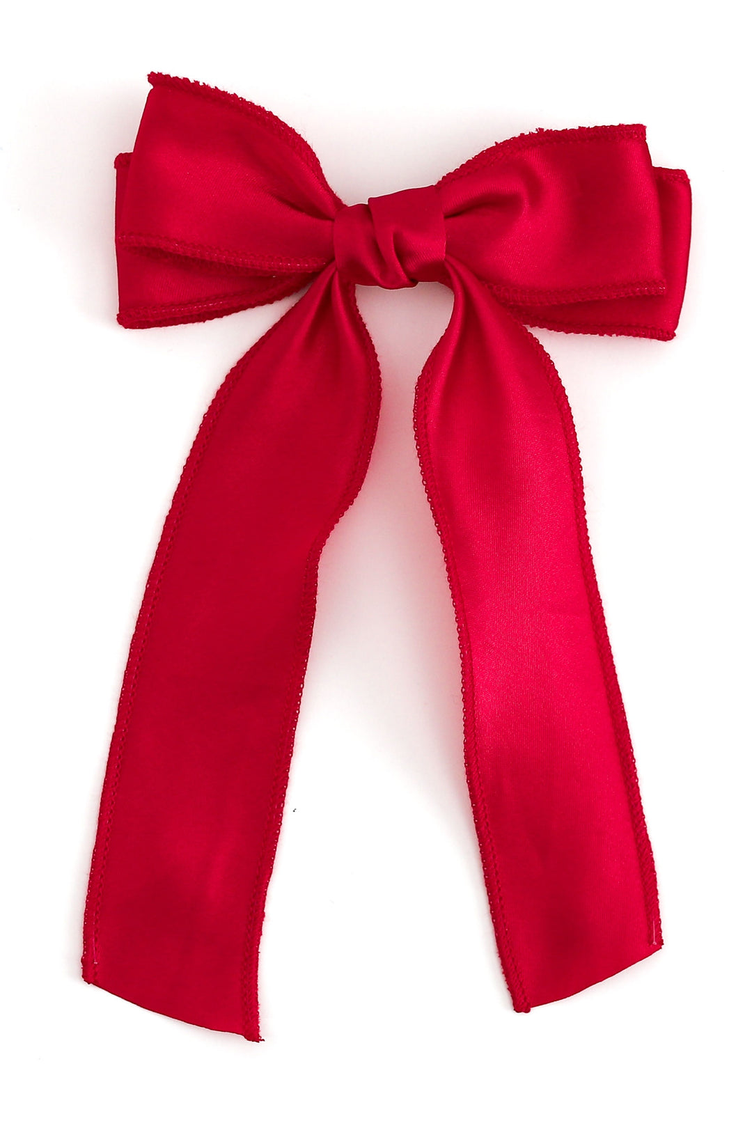 A bright red satin bow with long tails, photographed against a clean white background.