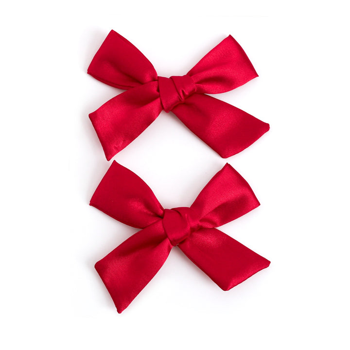 little girls bright red Christmas pigtail hairbows