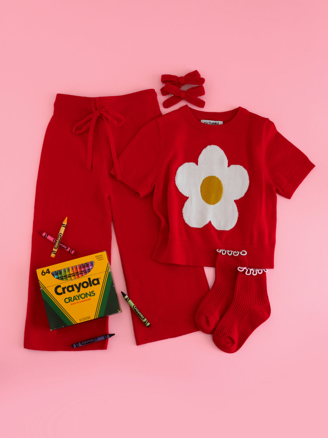 girls red cotton knit sweater set featuring short sleeve sweater with white flower design, matching red pants, midi socks and knit pigtail bows for back to school