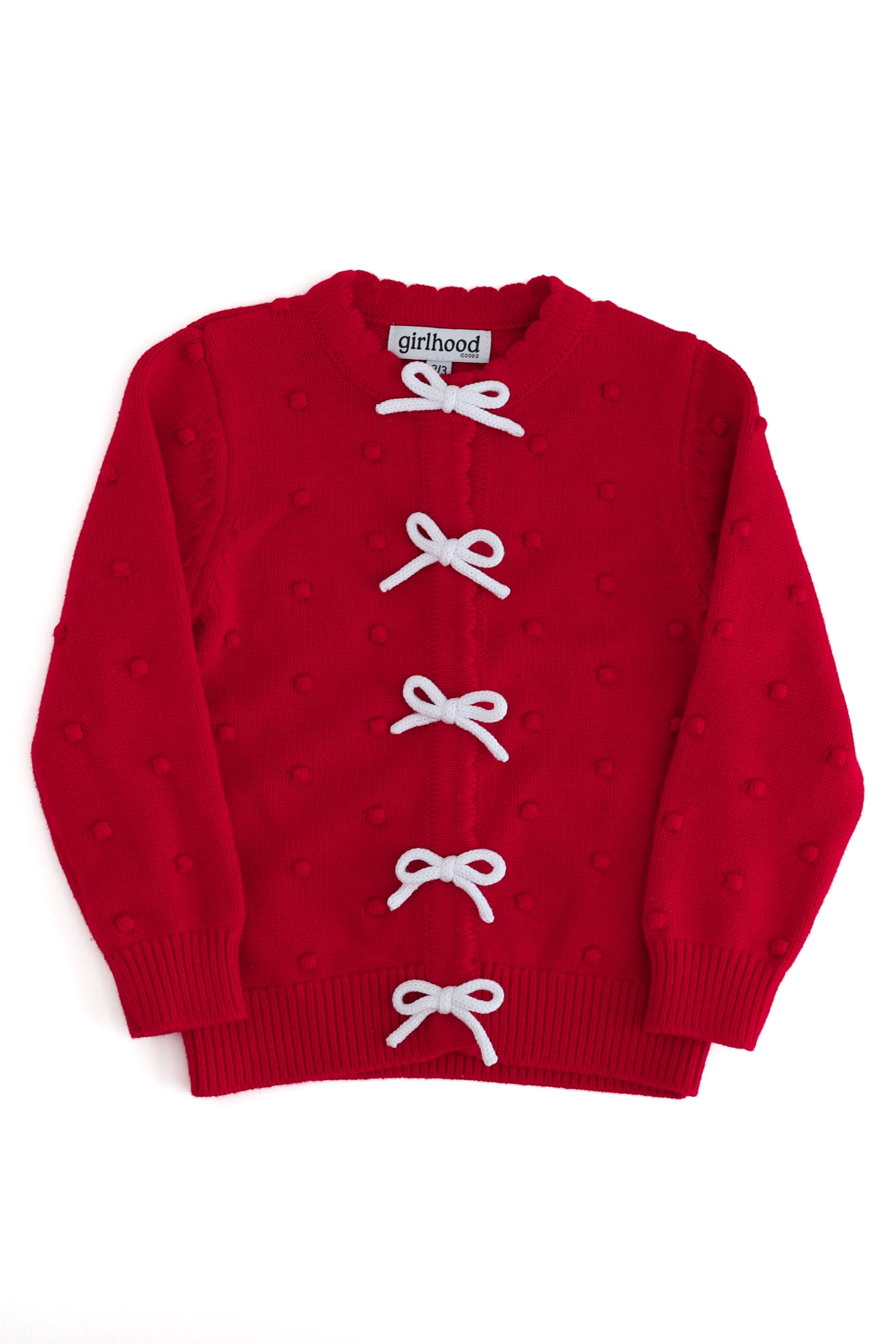 Girls' holiday bubble knit cotton cardigan in red with white knit bows and snap front