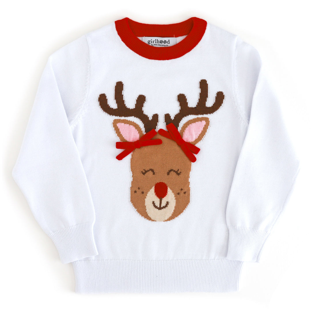 girls' white cotton knit pullover sweater with red neck trim and cute red nosed reindeer design wearing 3-D red pigtail bows