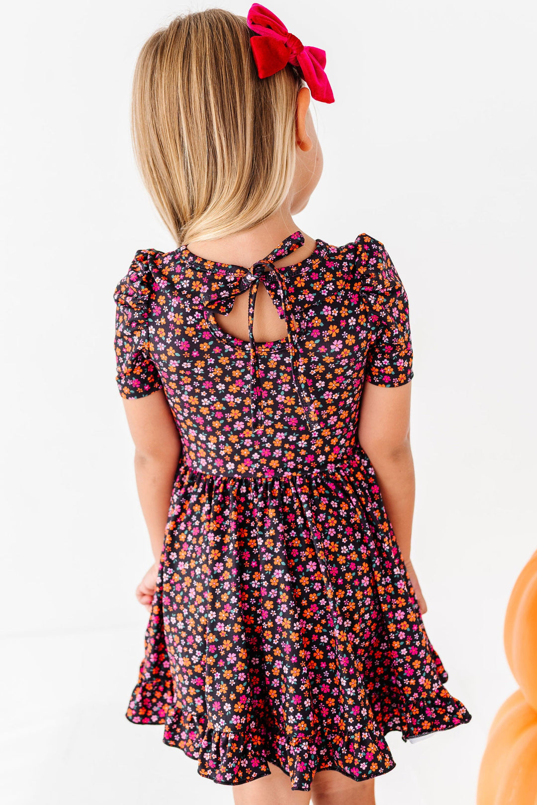 back detail of remember me floral dress with keyhole and bow tie