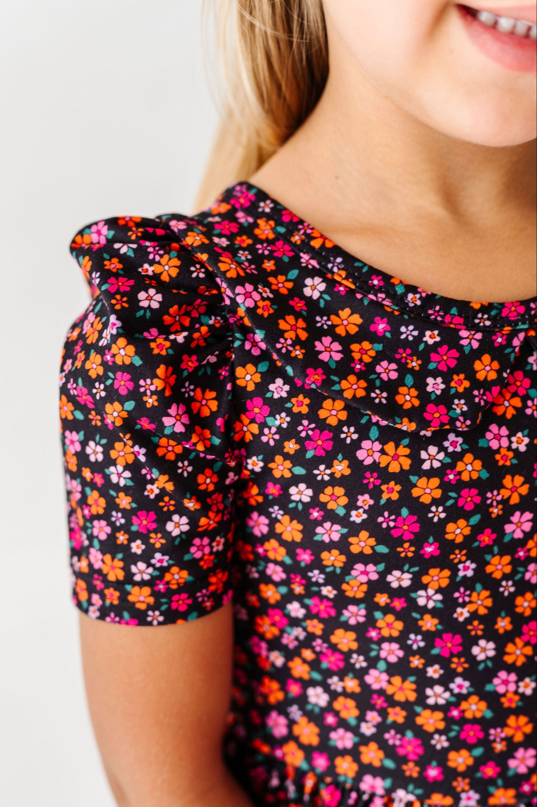 details of halloween floral print with pink and orange flowers on black dress for girls